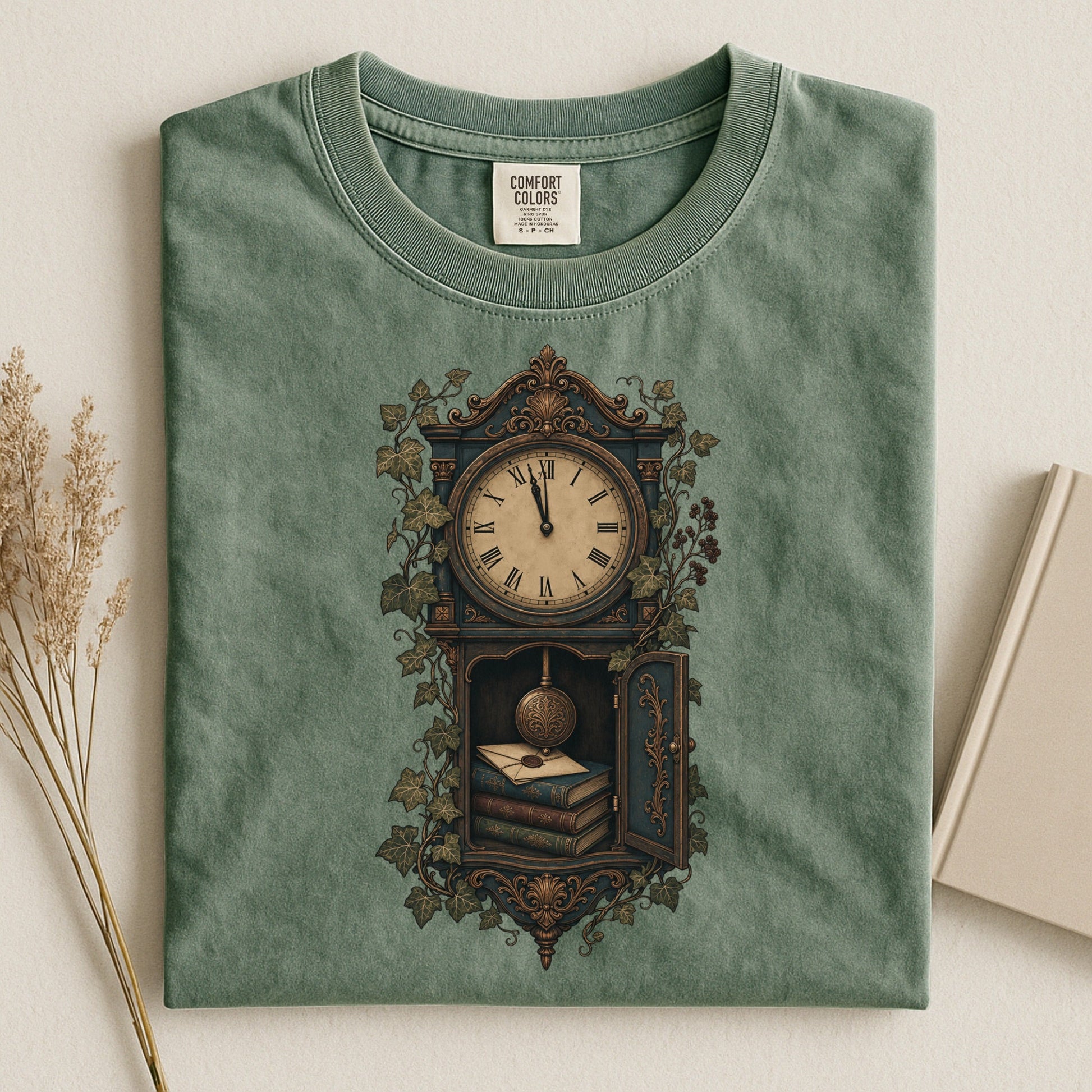 The Reading Hour bookish tee in Moss, flat lay