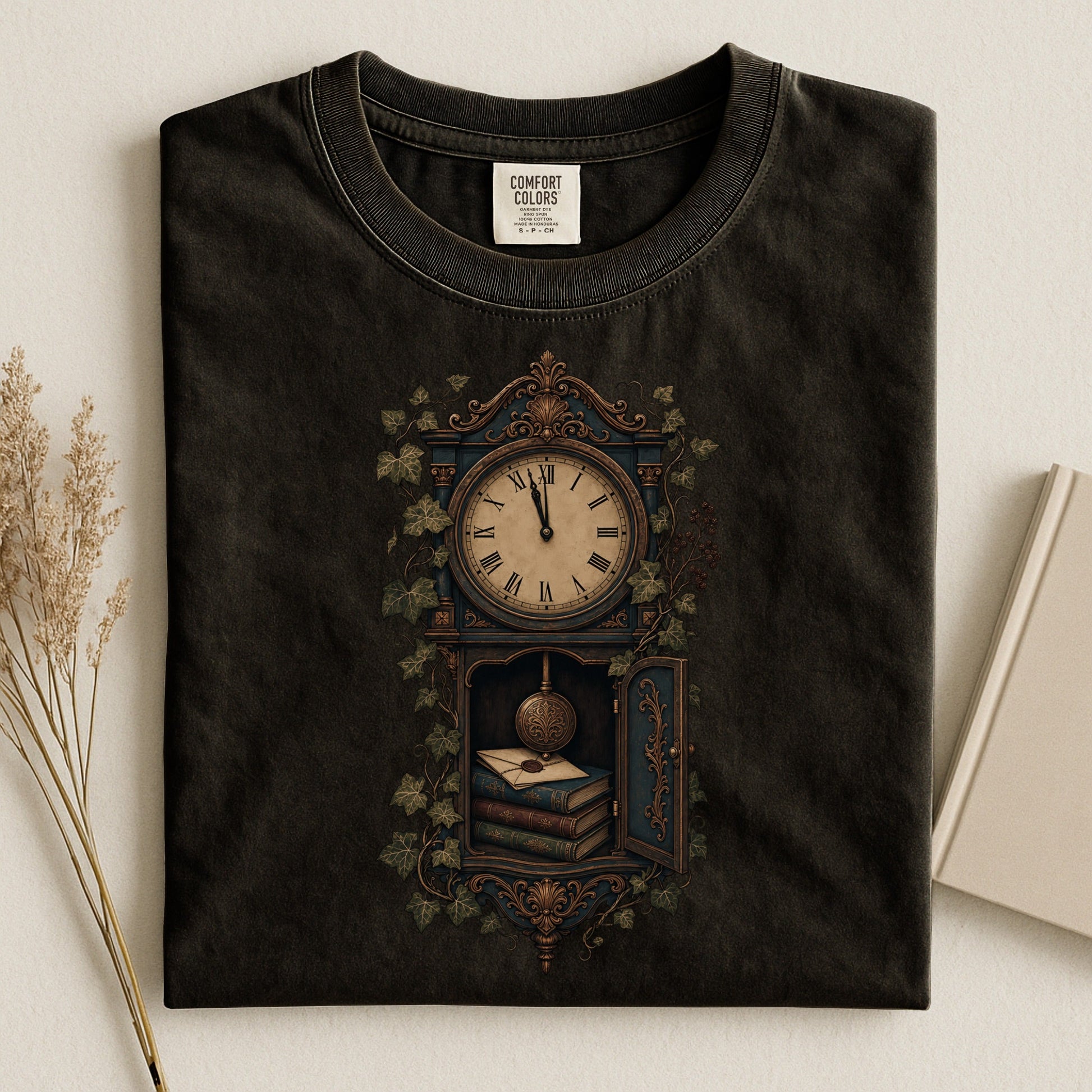 The Reading Hour bookish tee in Black, flat lay