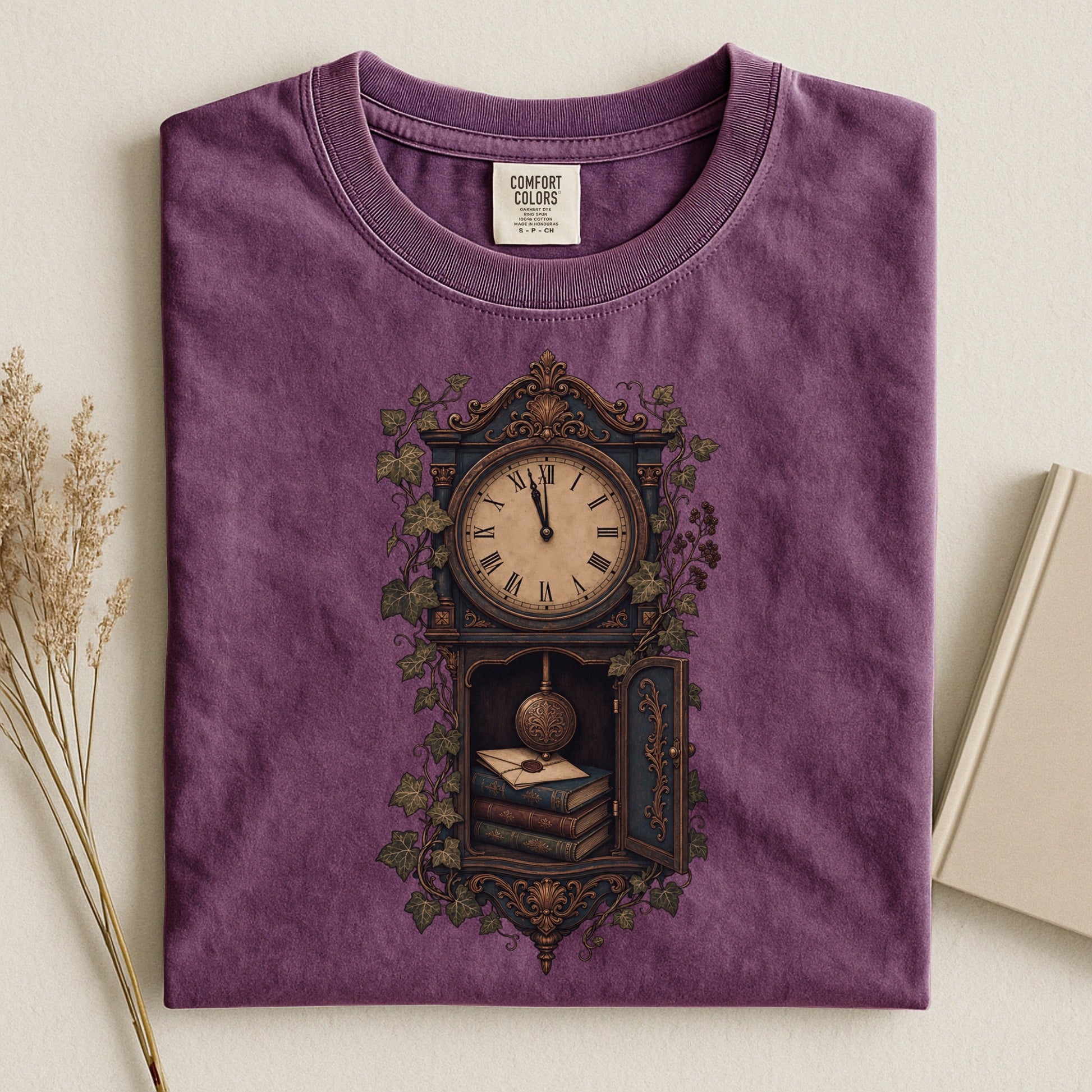 The Reading Hour bookish tee in Berry, flat lay
