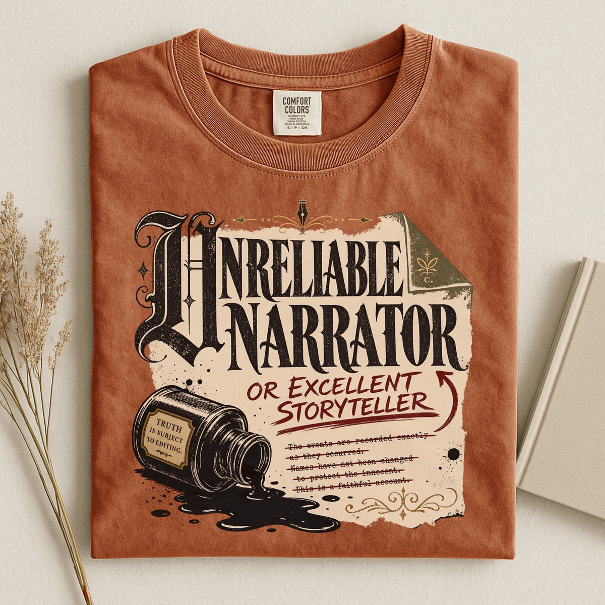 Shelf Love Studio Unreliable Narrator t-shirt in Yam, styled flat lay