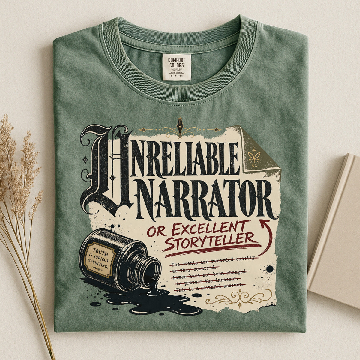 Shelf Love Studio Unreliable Narrator t-shirt in Moss, styled flat lay