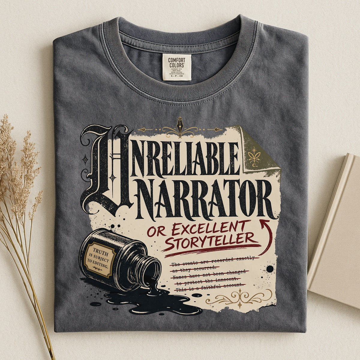 Shelf Love Studio Unreliable Narrator t-shirt in Pepper, styled flat lay