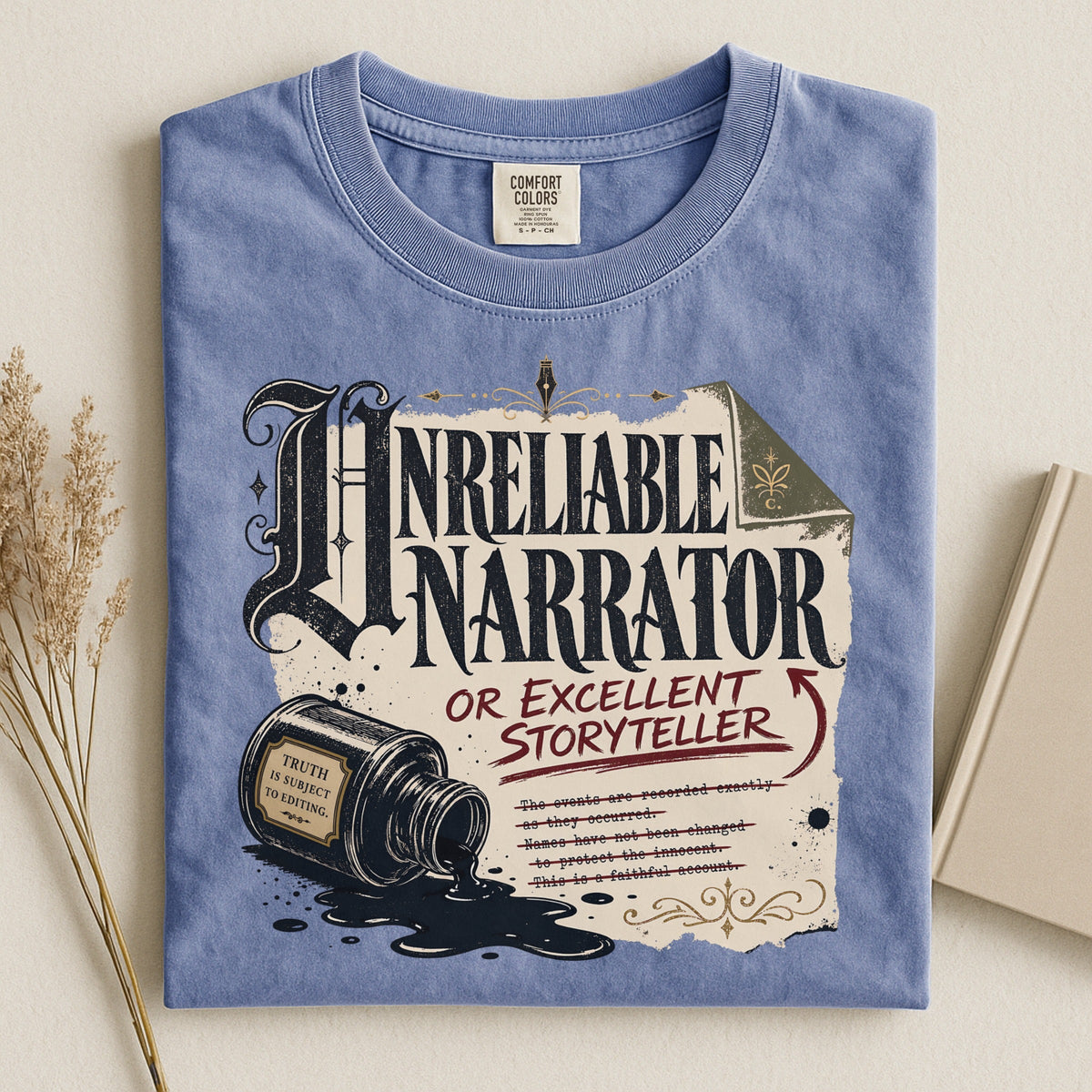 Shelf Love Studio Unreliable Narrator t-shirt in Blue Jean, styled flat lay