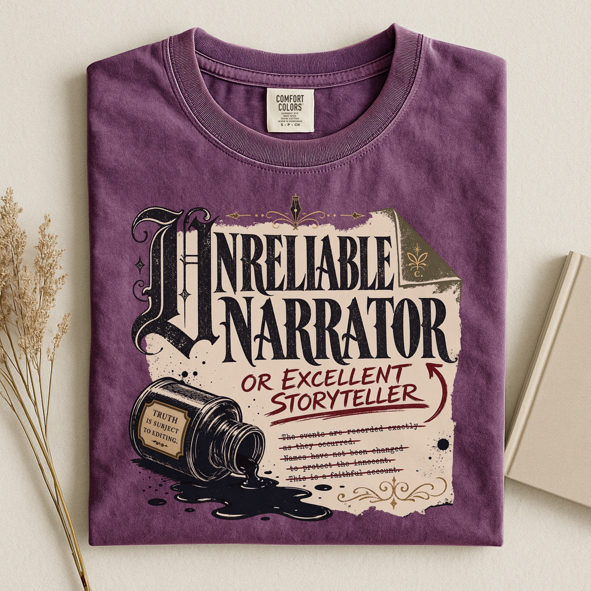 Shelf Love Studio Unreliable Narrator t-shirt in Berry, styled flat lay
