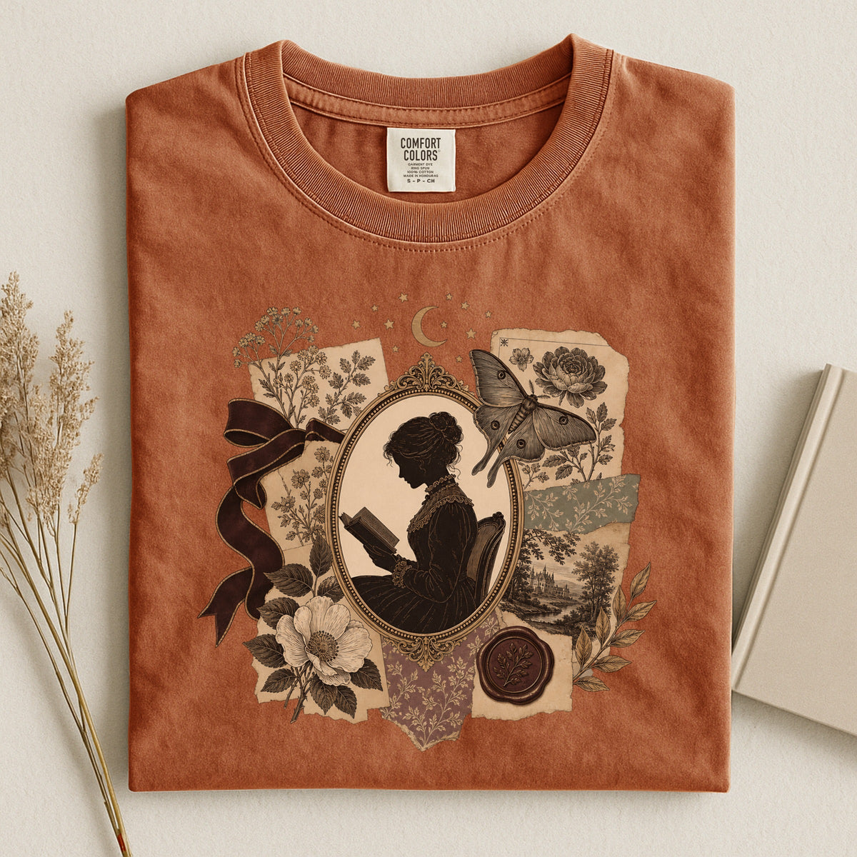 Shelf Love Studio Victorian Woman Reading t-shirt in Yam, styled flat lay