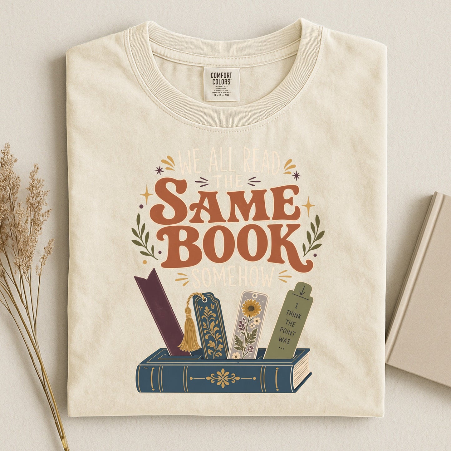 We All Read the Same Book Somehow bookish tee in Ivory, flat lay