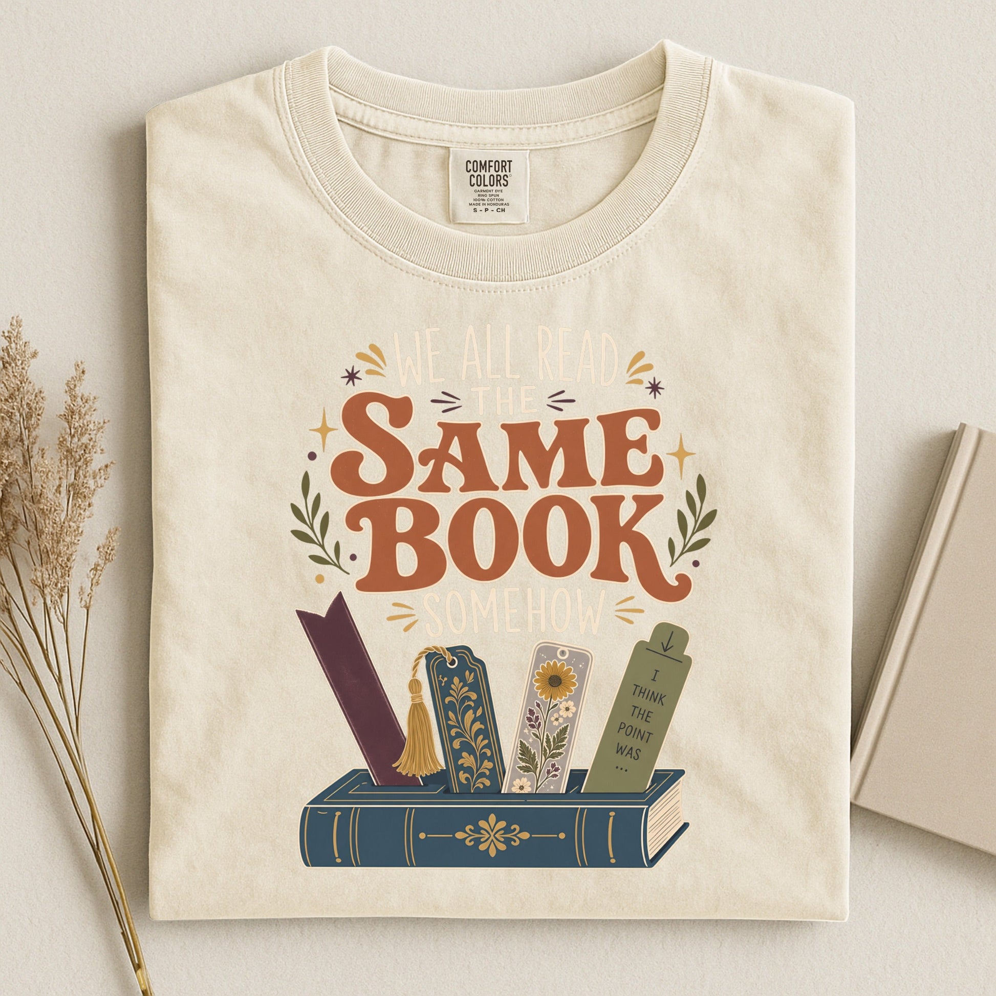 We All Read the Same Book Somehow bookish tee in Ivory, flat lay