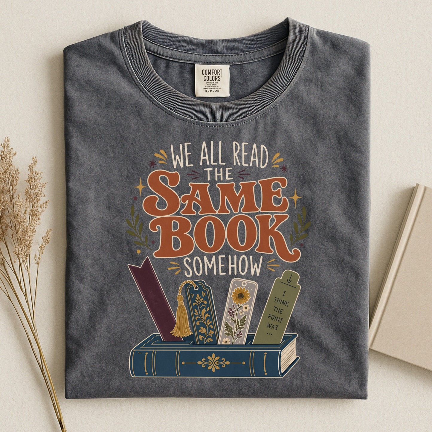 We All Read the Same Book Somehow bookish tee in Pepper, flat lay