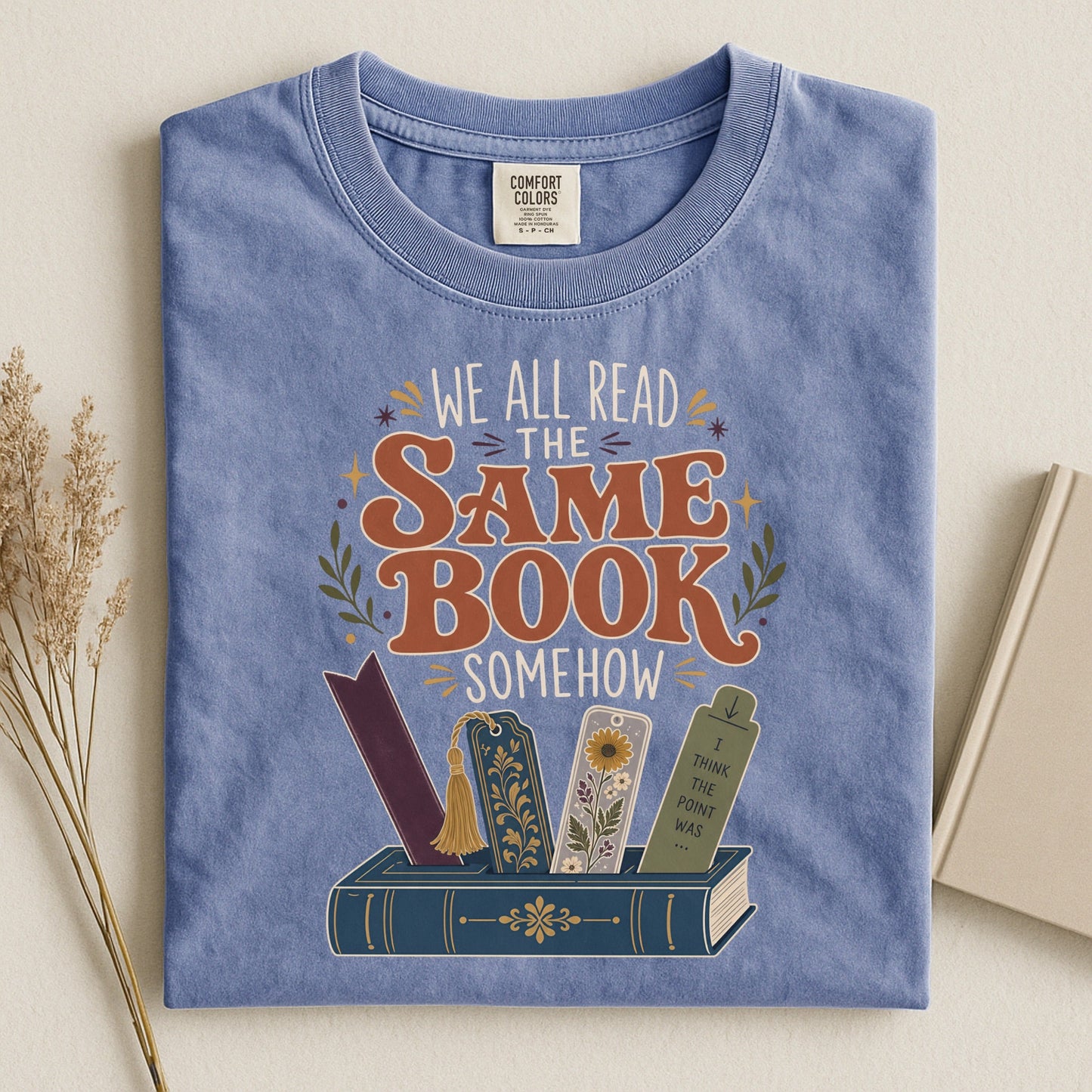 We All Read the Same Book Somehow bookish tee in Blue Jean, flat lay