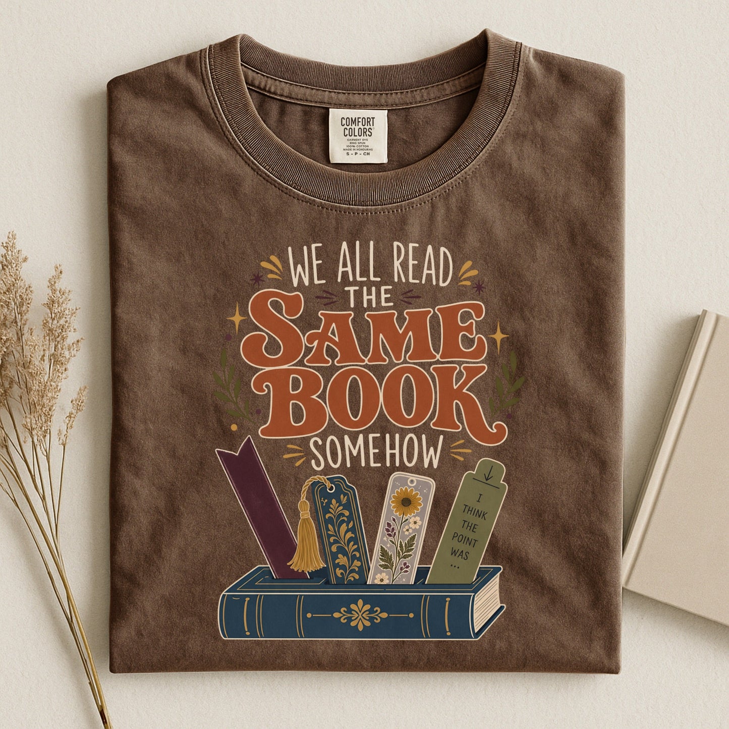 We All Read the Same Book Somehow bookish tee in Espresso, flat lay