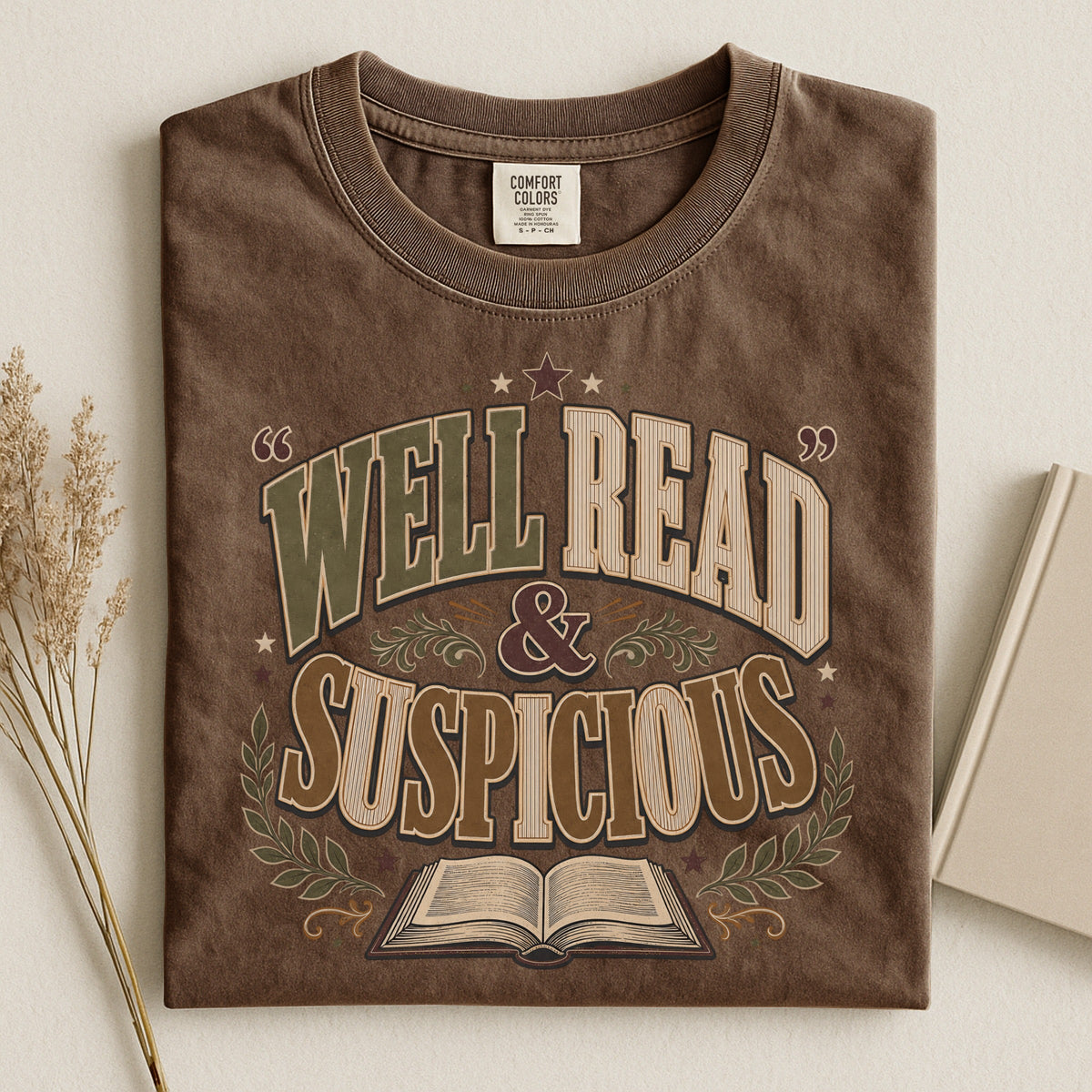 Shelf Love Studio Well Read & Suspicious t-shirt in Espresso, styled flat lay