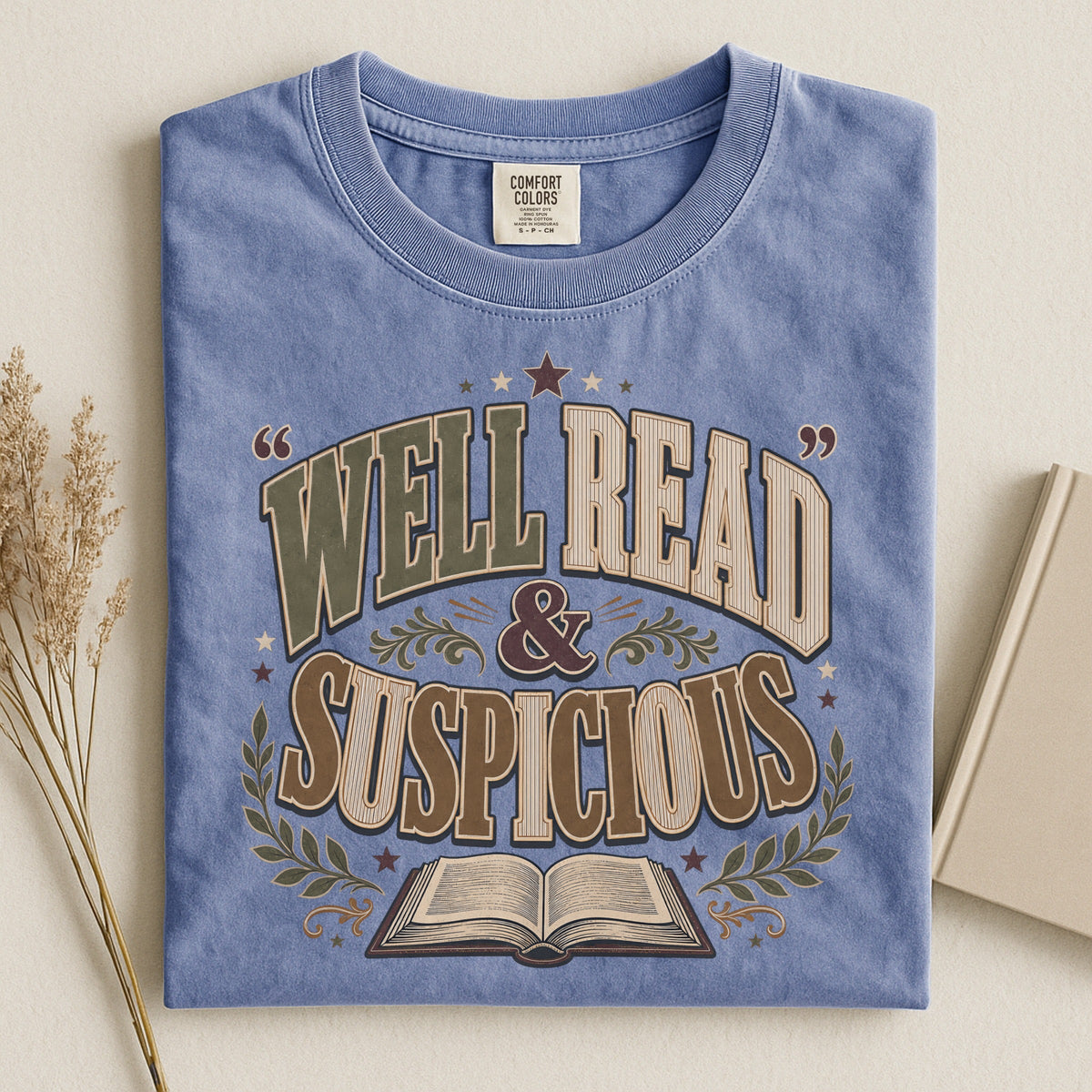 Shelf Love Studio Well Read & Suspicious t-shirt in Blue Jean, styled flat lay