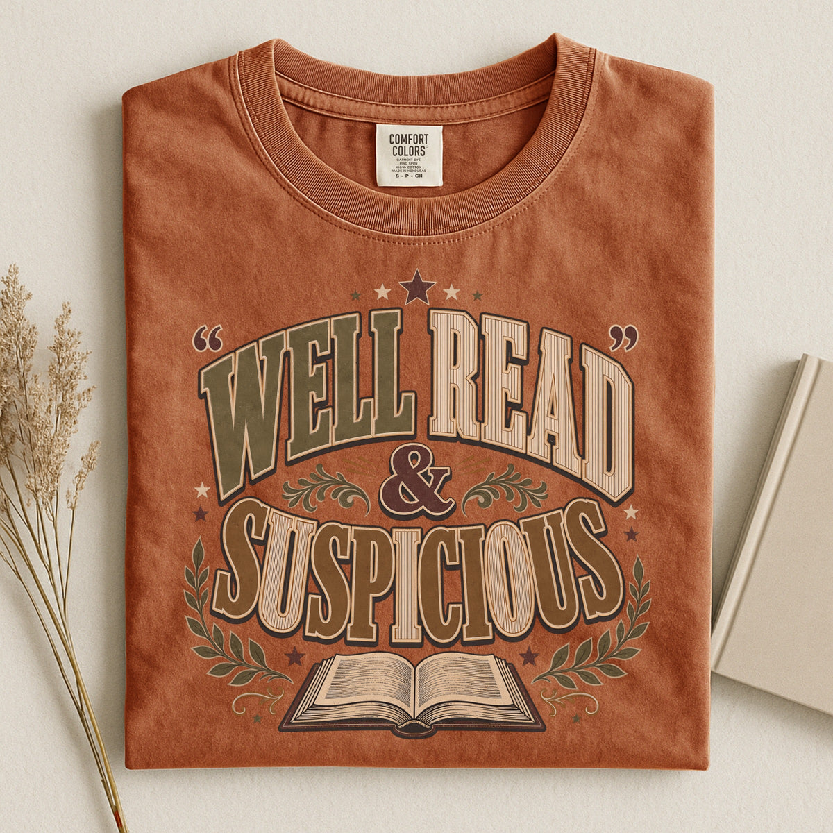 Shelf Love Studio Well Read & Suspicious t-shirt in Yam, styled flat lay