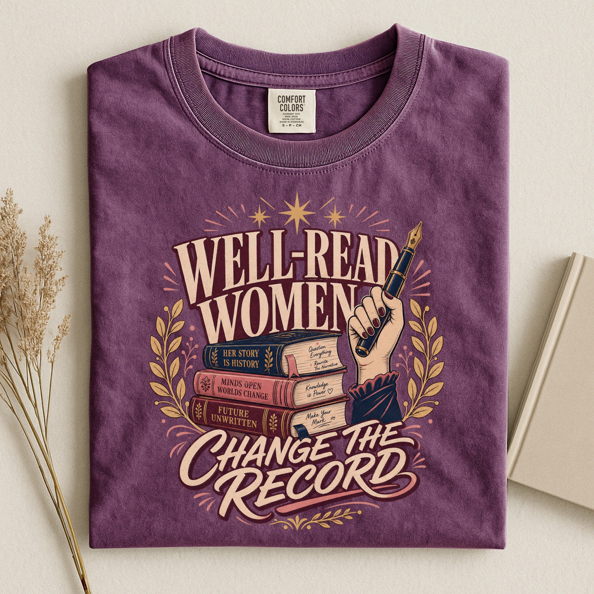 Shelf Love Studio Well-Read Women Change the Record t-shirt in Berry, styled flat lay