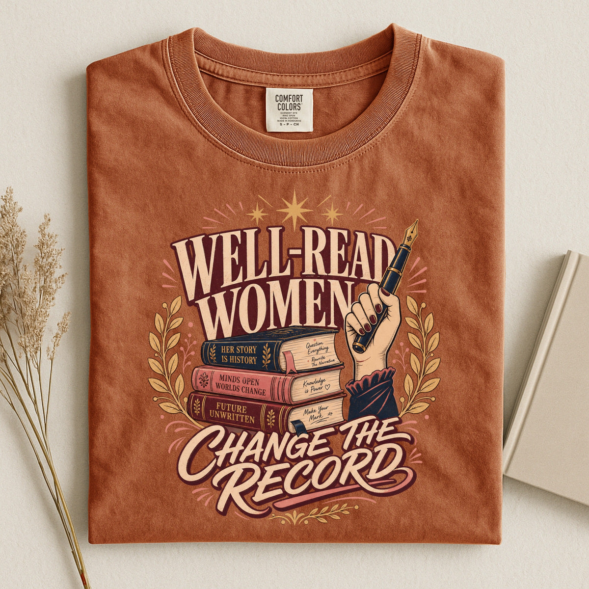 Shelf Love Studio Well-Read Women Change the Record t-shirt in Yam, styled flat lay